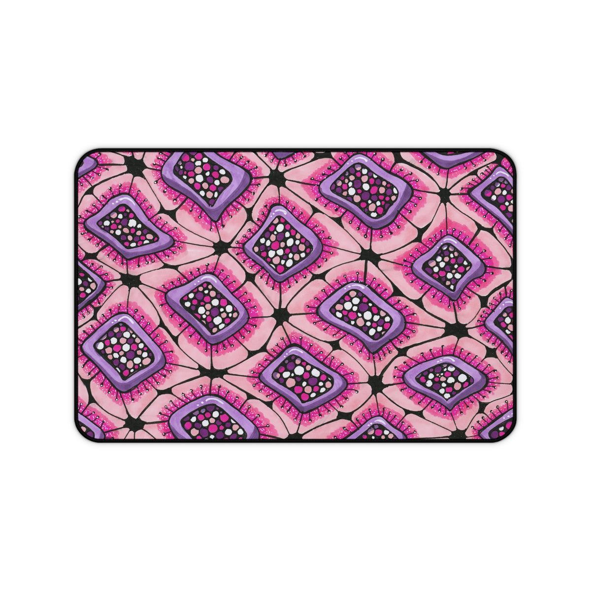 Bright pink print on a large desk mat and mouse pad