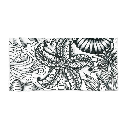 Hand-drawn sea life sketch on a large beach towel