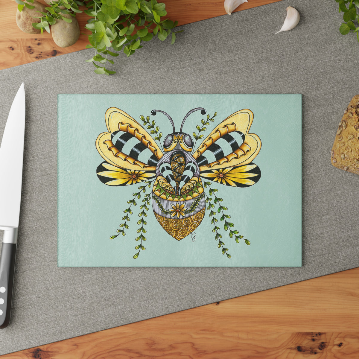 Queen Bee illustration on a tempered glass kitchen cutting board